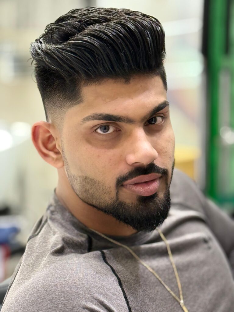 A man with beautifull look of beard and hair cut  at stylist hair salon 