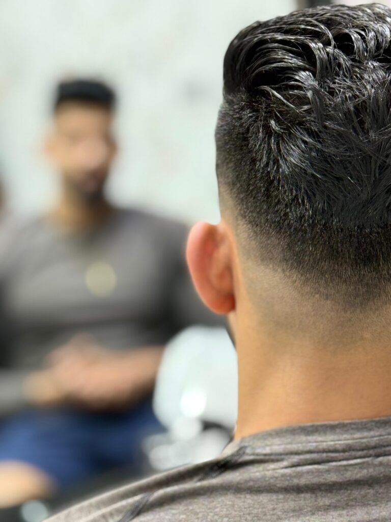 A man with beautifull look of beard and hair cut  at stylist hair salon 