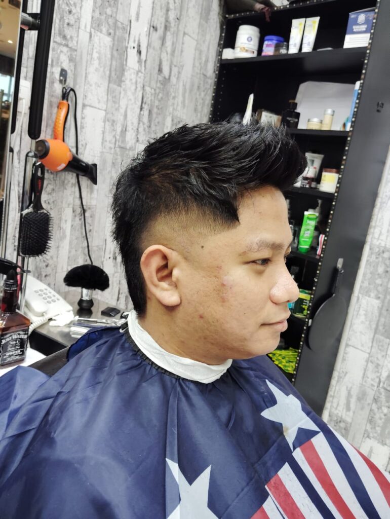 At Stylist Hair Salon Al Rigga Dubai, men can sport a chic, spiky hairstyle with skin fade.