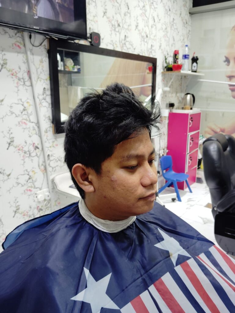 Men’s hairstyle before professional haircut at Stylist Hair Salon Al Rigga Dubai.